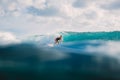 Surf girl on surfboard. Woman in ocean during surfing.