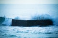 Surf on the pier. Atlantic Ocean. In blue tones