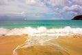 Waves meeting a pristine beach in the windward islands Royalty Free Stock Photo