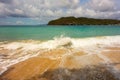 Waves meeting a pristine beach in the windward islands Royalty Free Stock Photo