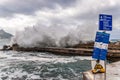 Surf with protective wall and warning signs on Majorca Royalty Free Stock Photo