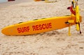 Surf rescue board on a white sand beach