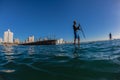 Surf Riders SUP Standing Morning Blue Royalty Free Stock Photo