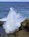 Surf rises thorugh famous blow-hole on coast of Oahu, Hawaii Royalty Free Stock Photo