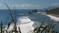 Surf rolls in at nine mile, near greymouth, on the west coast of new zealand