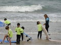 Surf school with children and teachers on the beach