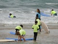 Surf school with children and teachers on the beach