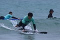 Surf school, a group of people are learning to surf in Chiba close to Ichinomiya.