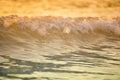 surf sea blured wave at golden light sunset beach background de Royalty Free Stock Photo