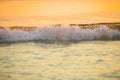 surf sea blured wave at golden light sunset beach background de Royalty Free Stock Photo