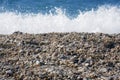 Surf on the sea. small pebbles on the shore.