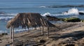 Surf shack, breaking wave, calm sea Royalty Free Stock Photo