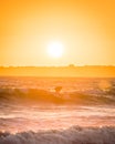 Surf take-off in the sunset in Brittany in France