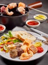 Surf and turf seafood and meat fondue Royalty Free Stock Photo