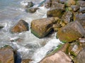 Surf. Waves crash on big rocks. Rocky coast and wave. coastline Royalty Free Stock Photo