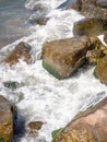 Surf. Waves crash on big rocks. Rocky shore and splashing waves. Powerful coastline. The excitement of the sea. Huge coastal rocks Royalty Free Stock Photo