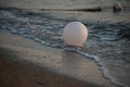 Surf and a white balloon. Dawn on the Mediterranean Sea. Kemer, Turkey