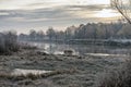 Surface of the autumn river. Dawn. Oakwood