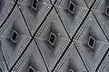 Surface of black and white fabric with geometric print and sequins Royalty Free Stock Photo