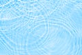 Surface of blue transparent swimming pool water with the circles on the water. Trendy abstract nature background. Water Royalty Free Stock Photo