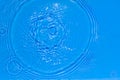 Surface of bright blue transparent swimming pool water texture with circles on the water. Trendy abstract nature Royalty Free Stock Photo