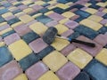 On the surface of the bright paving slabs `Old Town` lies a black rubber mallet Royalty Free Stock Photo