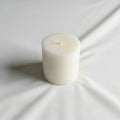 Surface. The candle is unlit, with a visible wick at the top. The Royalty Free Stock Photo