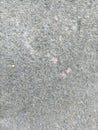 the surface of the cement floor has many small holes