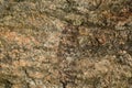 The surface of a chipped granite stone in warm sunny colors Royalty Free Stock Photo