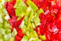 Surface coated with a sweet bell pepper cut into colorful pieces Royalty Free Stock Photo