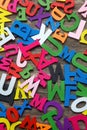 Surface covered with multiple colored wooden letters Royalty Free Stock Photo