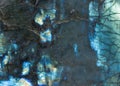 Labradorite surface showing iridescent blue color and texture