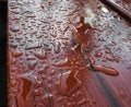 Surface in drops after rain. Droplet of water on wood. Abstract pattern of water droplets on a brown wooden surface Royalty Free Stock Photo