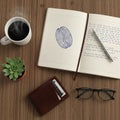 Surface features an open notebook with a drawn coffee bean and handwritten Royalty Free Stock Photo