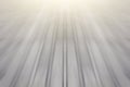 The surface of a gray color and an abstract display of rapid movement at high speed above it.