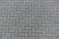 Surface of grey concrete pavement with herringbone layout Royalty Free Stock Photo