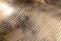 Surface of heavily used hihat bronze hand hammered cymbal. Royalty Free Stock Photo