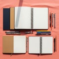 Surface include three open spiral bound notebooks with white pages various Royalty Free Stock Photo