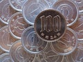 The surface of Japanese coins in 100 and 1 yen close-up. News about the economy, finances and interest rate of the central bank of Royalty Free Stock Photo