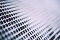 Surface of latticed metal fence. Stainless steel and aluminum light blur background. Macro texture