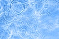 Surface of light blue transparent swimming pool water texture with circles on the water. Trendy abstract nature Royalty Free Stock Photo