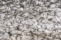 Surface of a melting mountain glacier covered with stones and rubble