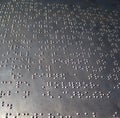 SURFACE OF METALLIC BRAILLE NOTICE BOARD Royalty Free Stock Photo