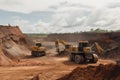 surface mining operation, with massive earthmoving equipment moving dirt and rock