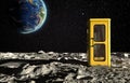 The surface of the moon with a phone booth and the planet Earth on a background of the starry sky. Creative conceptual 3D