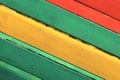 The surface of the nailed boards painted in green, yellow and red. Background picture Royalty Free Stock Photo