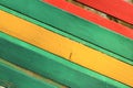 The surface of the nailed boards painted in green, yellow and red. Background picture Royalty Free Stock Photo