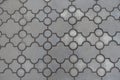 Surface of pavement of curved grey interlocking concrete tiles Royalty Free Stock Photo