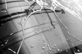 The Surface Protection of the car windows at the car wash under the jets of water. Black and white photo