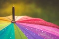 Surface of rainbow umbrella with raindrops on it Royalty Free Stock Photo